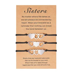 Ensemble de bracelets d'amitié de sœur en acier inoxydable avec carte en kraft.