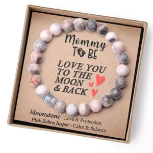 Bracelet de perles en cristal avec jaspe zébré rose et pierre de lune dans une boîte.