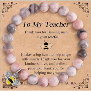 Teacher appreciation beaded bracelet detail view featuring pink jasper beads and cute bee charm.