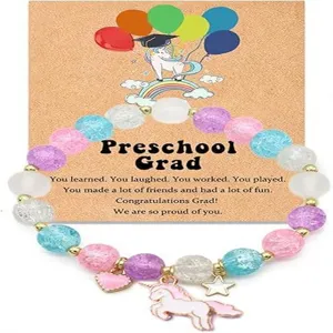 Preschool graduation beaded bracelet with cute unicorn card gift for kids celebration.