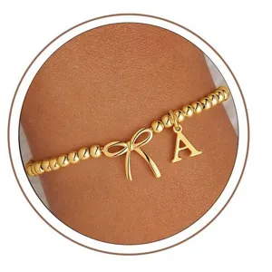 Gold bow stretch bracelet with letter A charm fashion jewelry for women daily wear