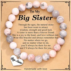 Natural stone bead bracelet detail with big sister heart charm and message card for women.