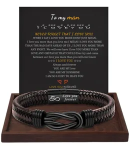 Detailed view of braided leather bracelet featuring magnetic stainless steel clasp and message card.
