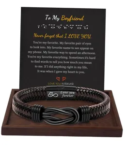 Detailed view of braided leather bracelet with magnetic clasp and message card for men.