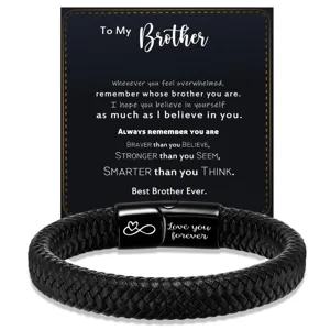 Detailed view of a black braided leather bracelet with a stainless steel magnetic clasp.