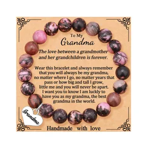 Detailed view of handmade gemstone beaded bracelet with heart pendant for grandma gift.