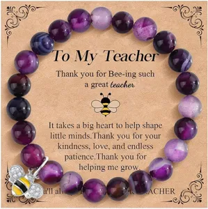 Teacher appreciation beaded bracelet with cute bee charm and gratitude card gift for women.