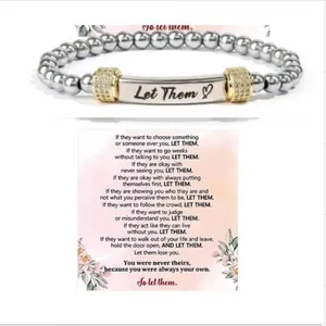 Stainless steel beaded stretch bracelet with engraved metal bar and inspirational quote card.
