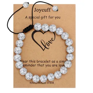 White Howlite beaded bracelet with adjustable cord and greeting card gift packaging.
