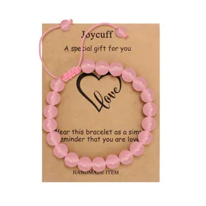 Pink crystal bead bracelet detail view with gift card and handmade adjustable cord design.