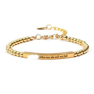 Gold stainless steel beaded bracelet with engraved bar detail, adjustable length.