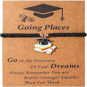 Graduation braided bracelet detail shot, elegant black rope design with graduation cap charm card gift.