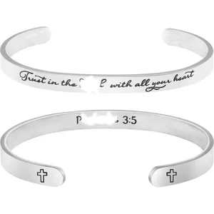 Stainless steel cross cuff bracelet detail view, engraved inspirational Bible verse jewelry.