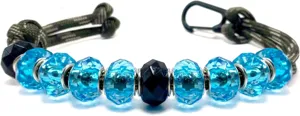 Paracord golf bead keychain detail showing blue crystal acrylic beads and black carabiner clasp.