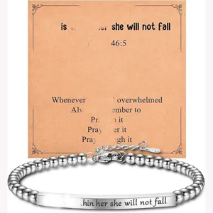 Stainless steel bead chain bracelet detail, featuring engraved text plate and backing card.