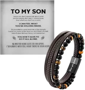 Detail shot of multi-layer men's leather bracelet with tiger eye beads and message card.