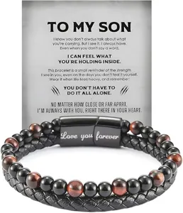 Closeup view of mens layered leather tiger eye stone bracelet stainless steel clasp detail shot.