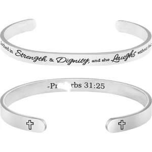 Stainless steel cuff bracelet detail showcasing engraved Bible verse Proverbs 31:25 and cross.