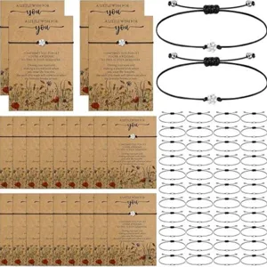 Handmade black braided cord wish bracelet with flower charm and kraft card gift set.