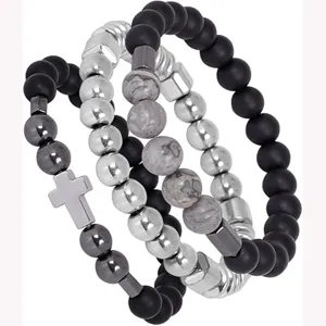 Stylish multi-layer beaded bracelet set with cross charm and magnetic hematite beads.