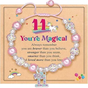 Handmade braided unicorn pendant pink pearl beaded bracelet with inspirational quote card.