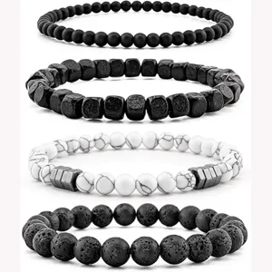 Set of 4 beaded bracelets featuring black matte, lava stone, white marble and metal beads.