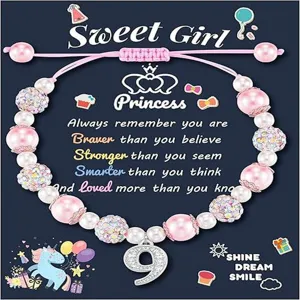 Details of the handmade pink pearl beaded bracelet with unicorn card and number 9 pendant.