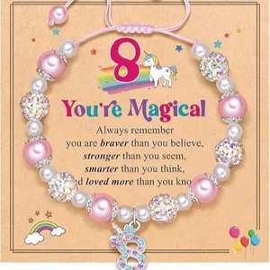 Handmade woven unicorn charm beaded bracelet with pink pearls and sparkling rhinestone balls for girls.