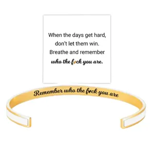 Stainless steel cuff bracelet with inspirational engraved quote and matching display card.