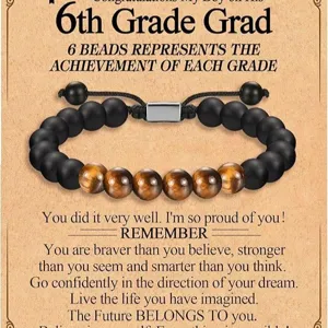 Pulsera de ojo de tigre y cuentas negras mates con elemento de acero para graduacion.