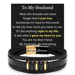 Detailed close-up of men's multi-layer braided leather bracelet with stainless steel clasp.