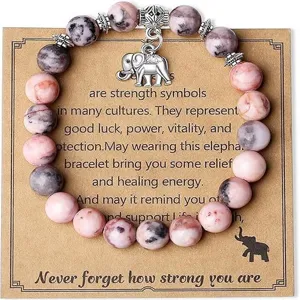 Close-up detail of natural stone beaded bracelet with cute elephant charm on kraft card.