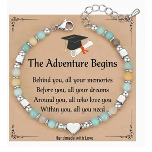 Detailed close-up of natural stone beaded graduation bracelet with heart charm and card.
