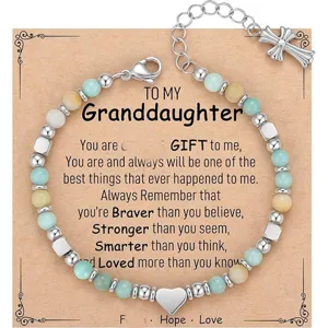 Granddaughter natural stone beaded bracelet with heart charm and cross extension chain detail.