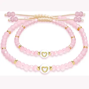 Mom and me pink crystal beaded bracelets set with cute heart charms and adjustable cords.