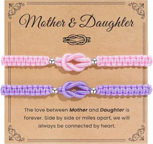 Detailed close-up view of the mother daughter woven bracelet set with pink and purple knots.