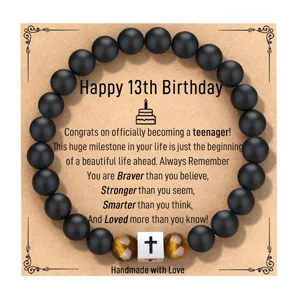 Pulsera de obsidiana natural y ojo de tigre mate con cruz de acero detalle de producto