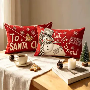 Weihnachtlicher Kissenbezug aus leinenähnlichem Stoff mit Schneemann- und Weihnachtsmotiv.