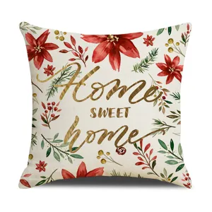 Christmas linen throw pillow cover with red poinsettia and gold typography for home decor sofa bed.