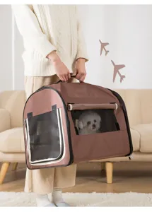 Detailed view of the portable brown pet carrier bag featuring breathable mesh windows for small dogs.