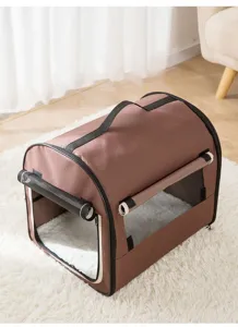 Portable brown pet carrier bag detail view with mesh window and cozy interior pad for cats dogs.