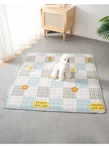 Detailed view of the checkered pet mat in room setting, soft fabric with cute cartoon patterns.