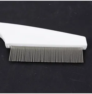 Stainless steel pet flea comb with fine dense metal teeth for grooming and removing loose pet hair.