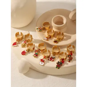 Christmas gold stainless steel ring set with cute enamel charms like reindeer and Santa.