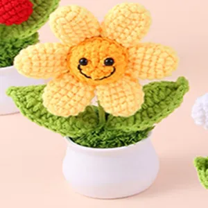 Handmade crochet sunflower potted plant with cute smiley face, perfect desktop decor gift.