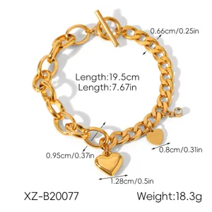 Gold stainless steel toggle clasp chain bracelet with heart charms and clear crystal.