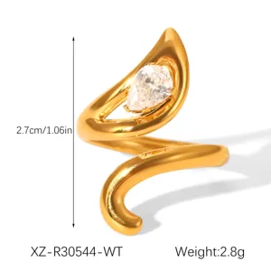 Detailed view of gold plated titanium steel ring with sparkling pear zircon stone detail.