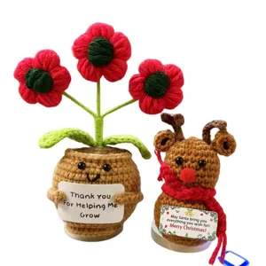 Handmade crochet potted flower and cute Christmas reindeer plush doll set for home decor.