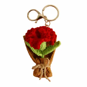 Handcrafted crochet flower bouquet keychain detail, knit rose bag charm accessory