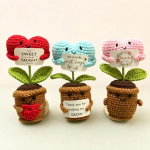 Handmade crochet heart flower potted plant detail view, cute knitted yarn doll desk decor